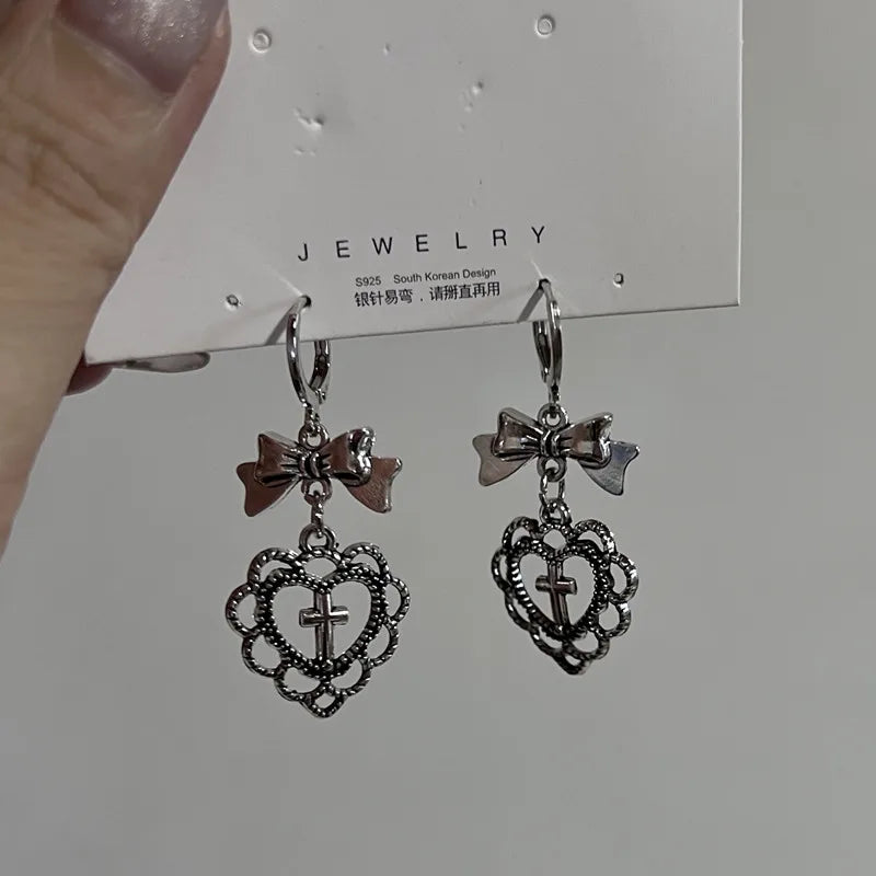 Jirai Kei Mismatched Heart Cross Bow Dangle Earrings Silver 01 Shoptery