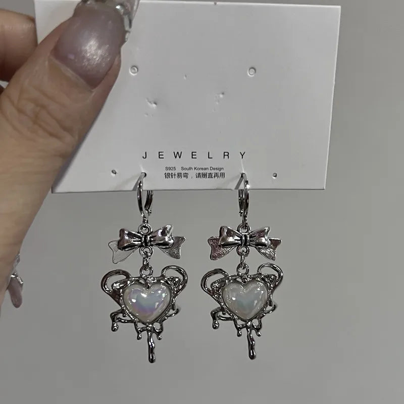 Jirai Kei Mismatched Heart Cross Bow Dangle Earrings Silver 02 Shoptery